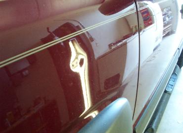 Dent in side of car before